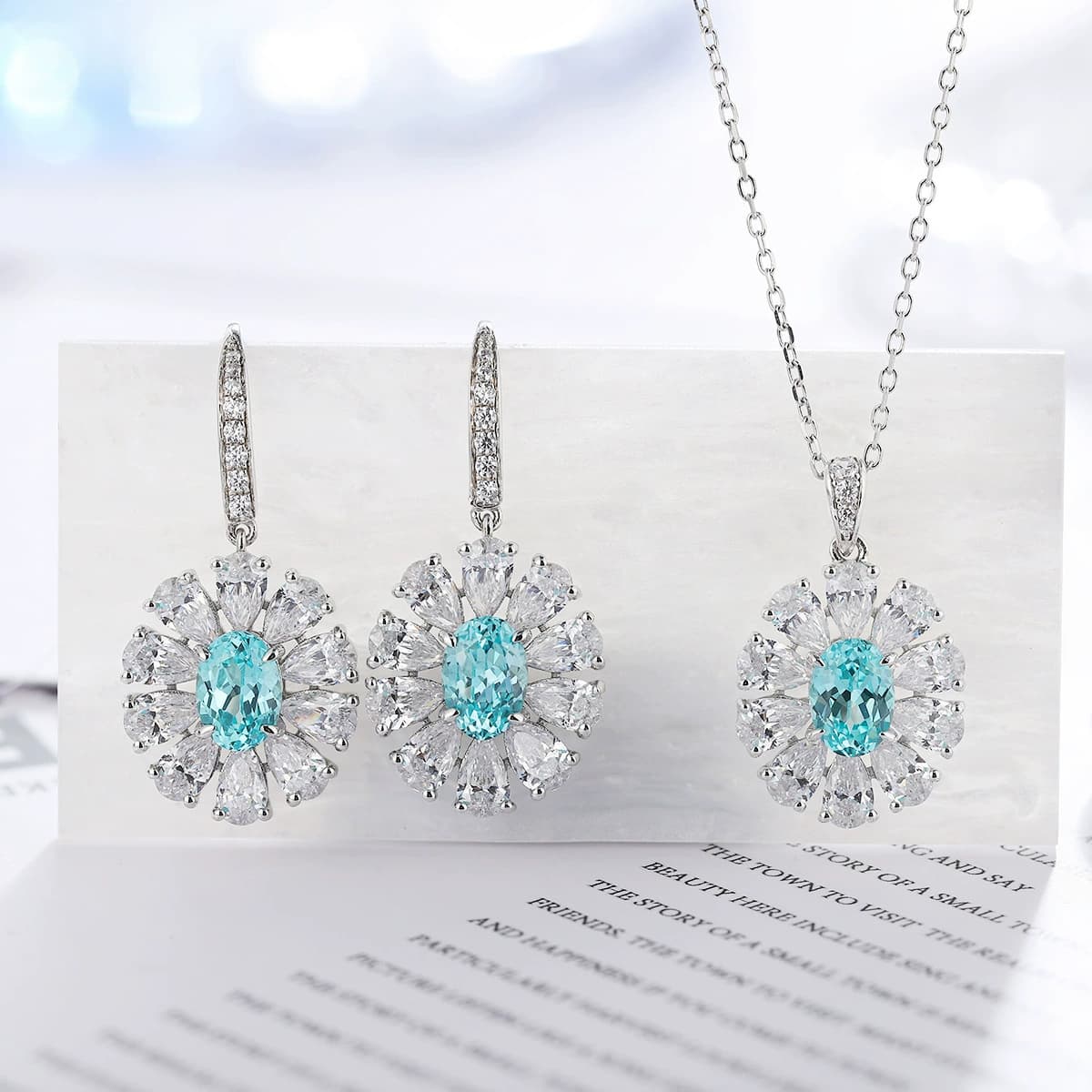 Blue lab-created colored gemstone pendant and matching earrings