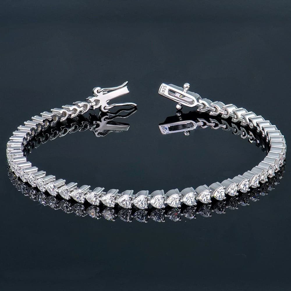 Moissanite tennis bracelet on a black reflective surface
